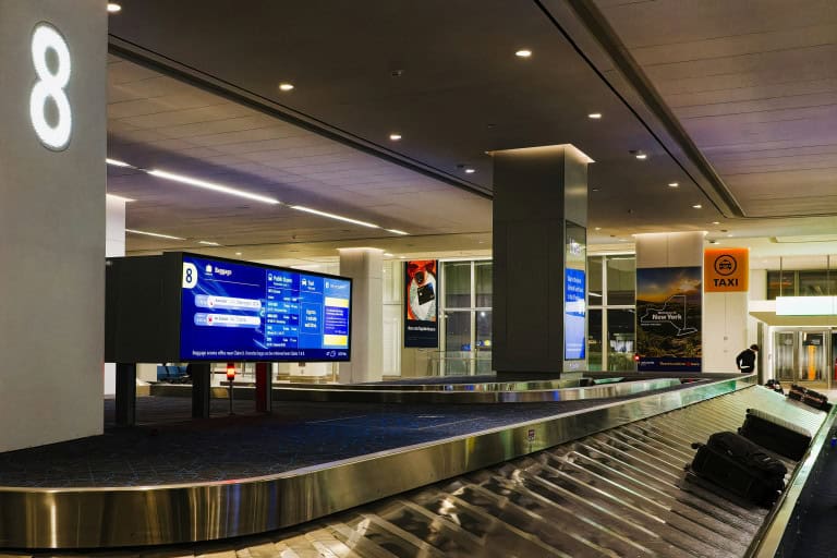 Empty baggage claim area at airport where you check a bag.
